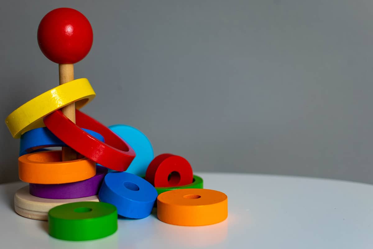 Blue, green, yellow, and red educational toy used in Child Development Evaluations NYC
